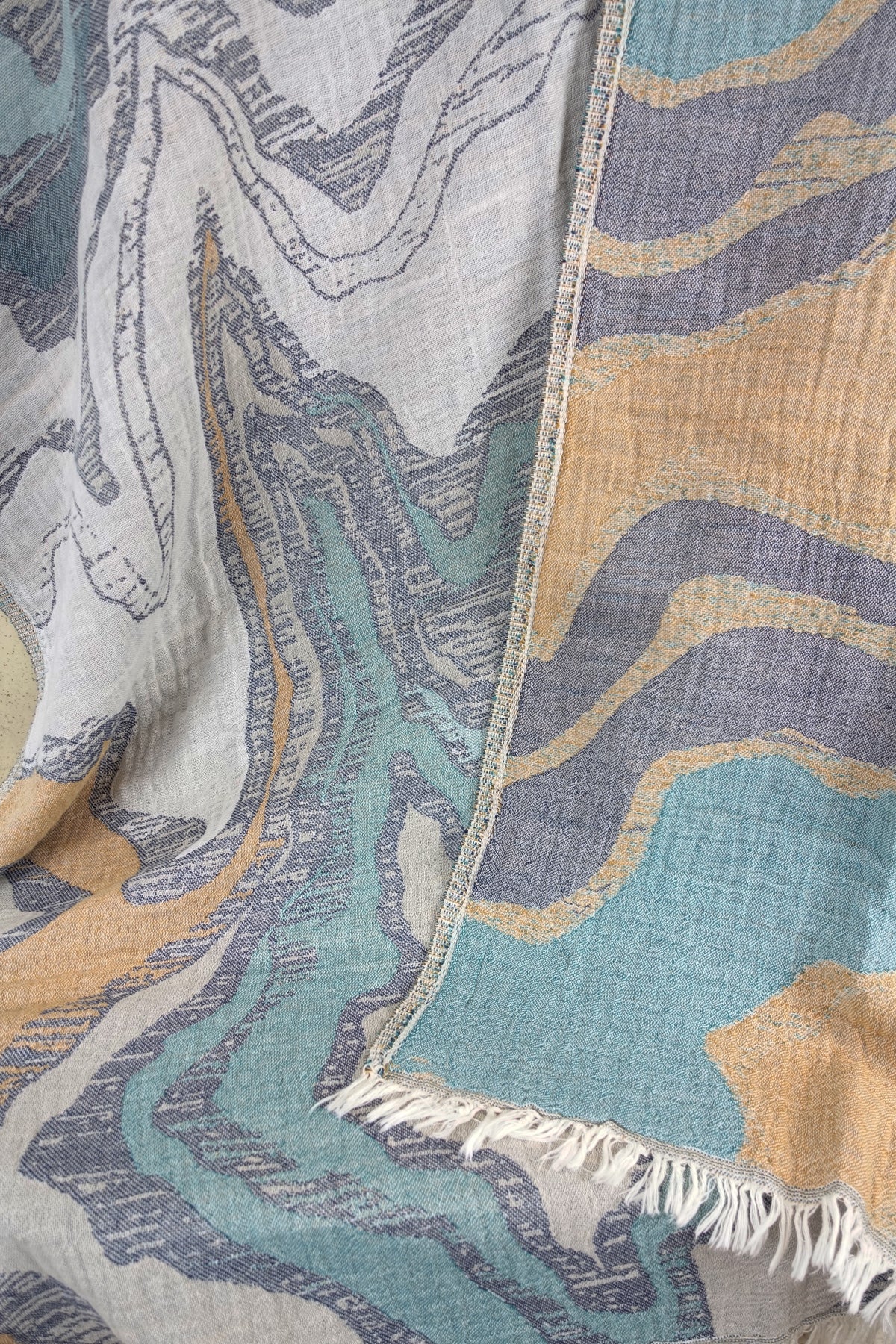 serviette de bain luxueuse reflets turquoise ocre